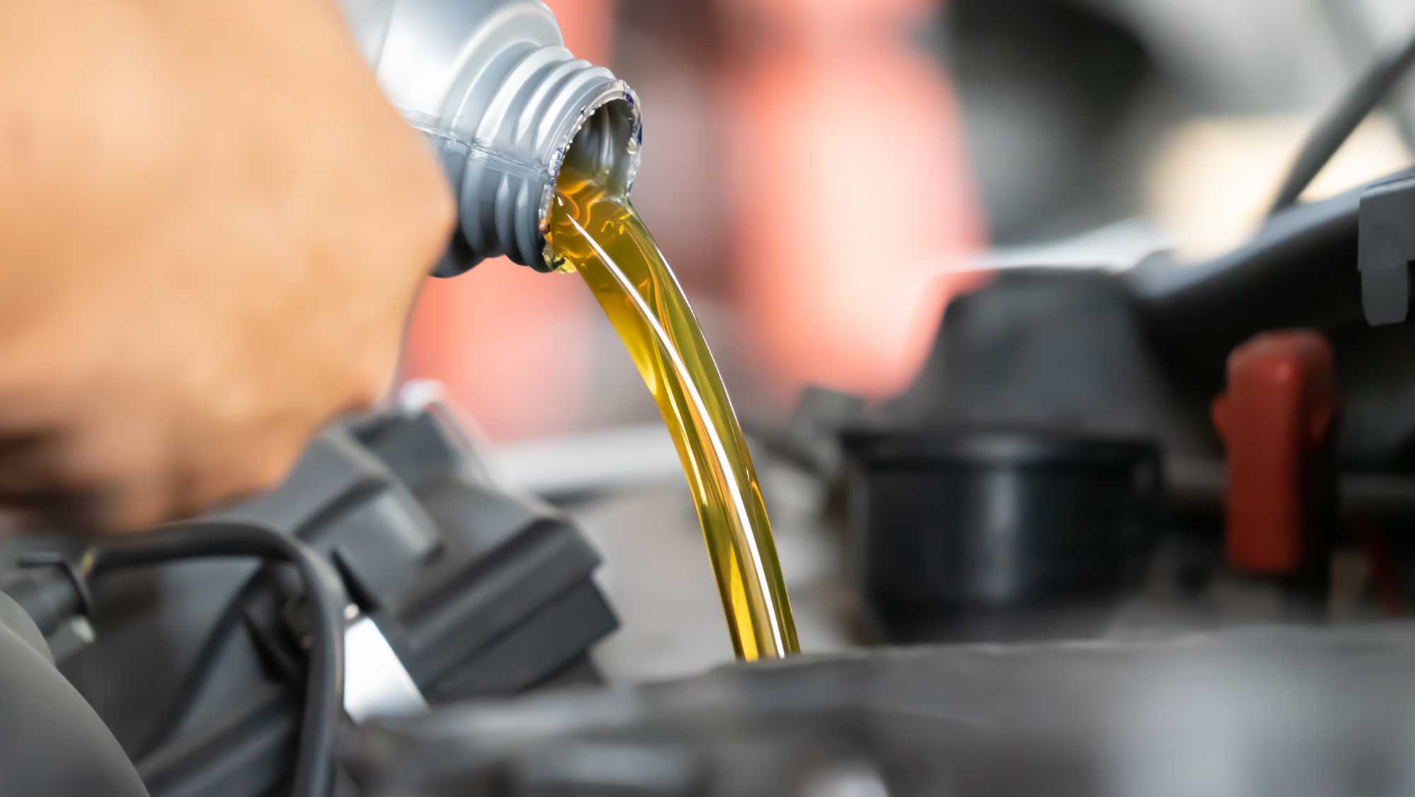 technician performing an oil change on West Main Street in Dothan, AL