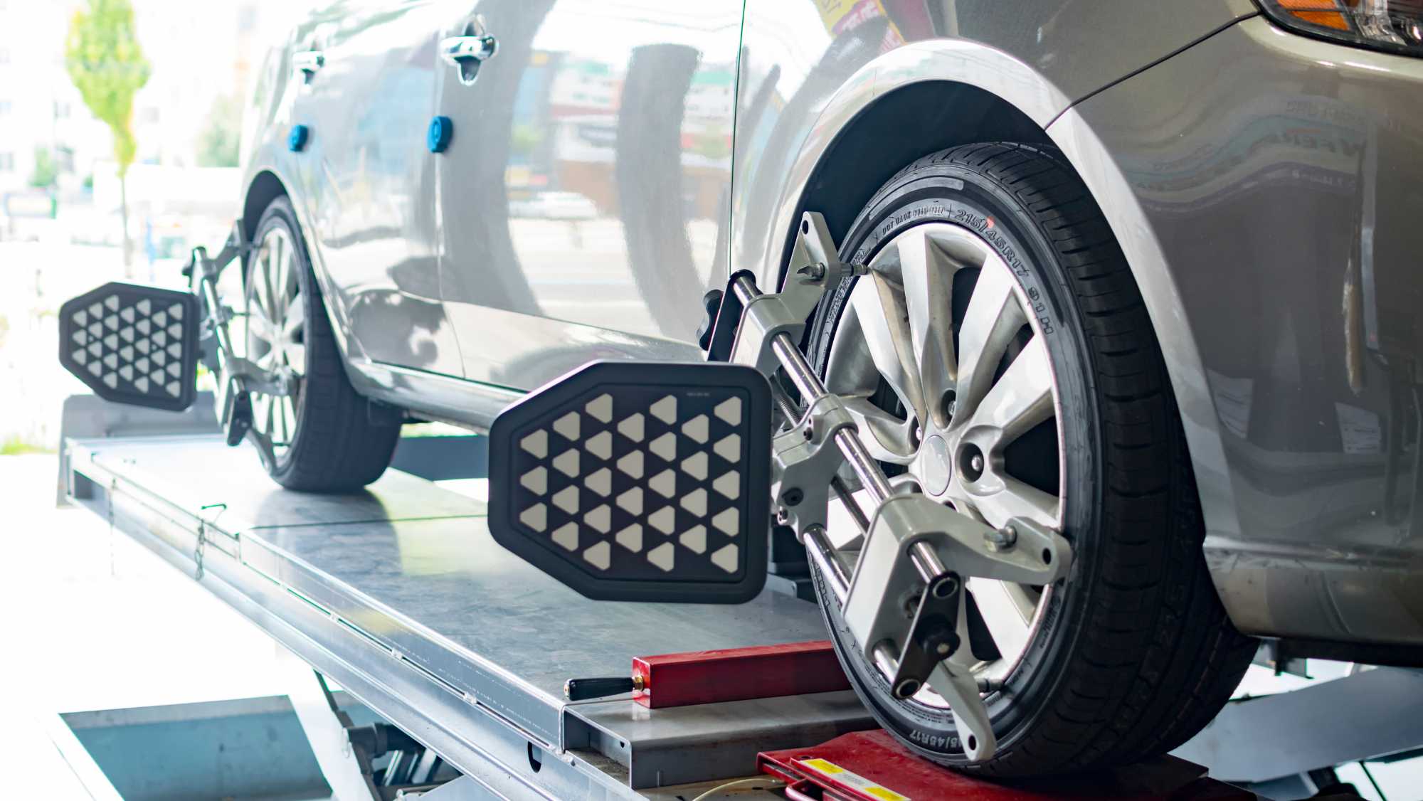 technician adjusting tires - wheel alignment service in Dothan AL