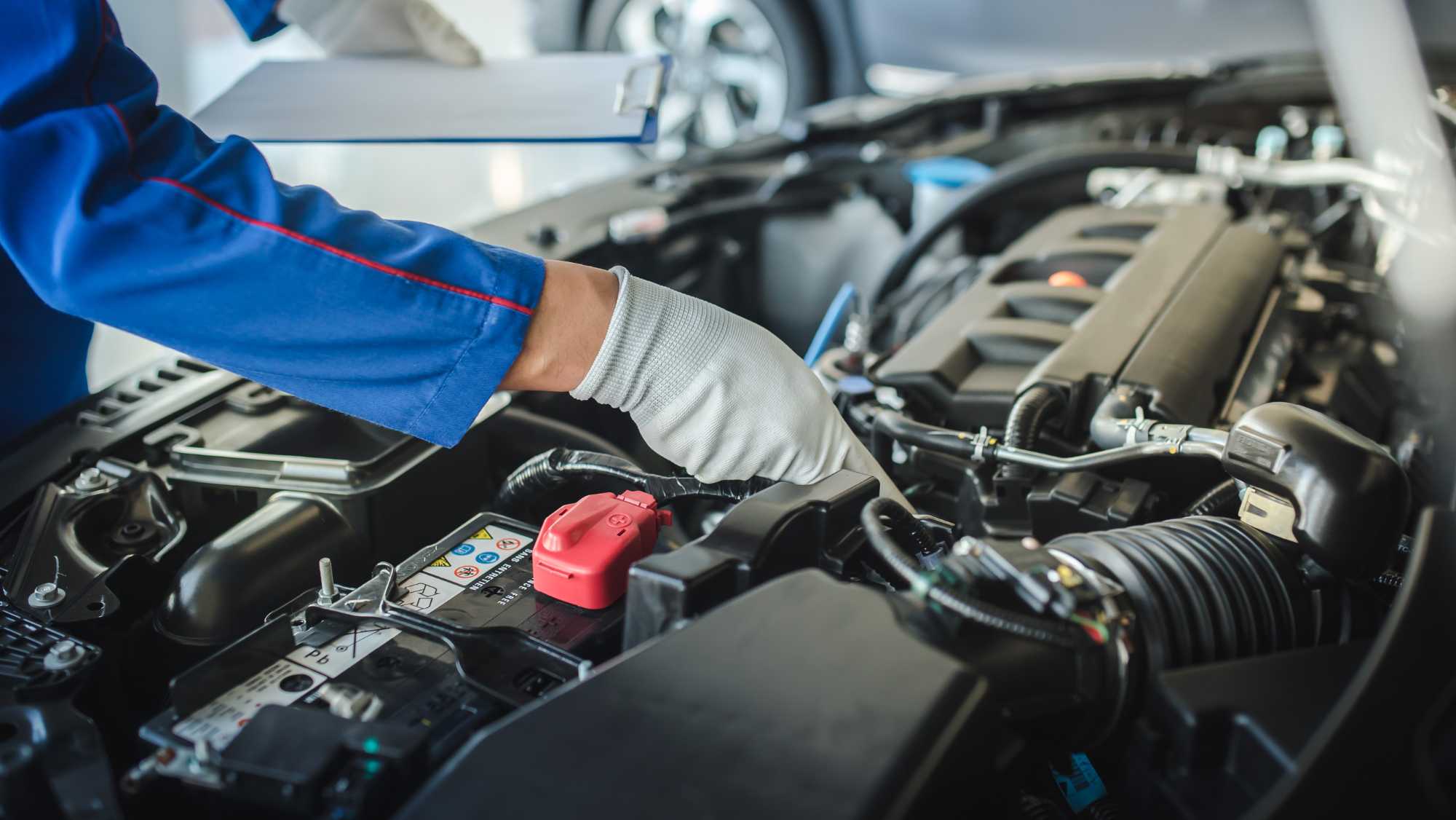 Auto repair technician inspecting vehicle diagnostics in Ozark, Alabama