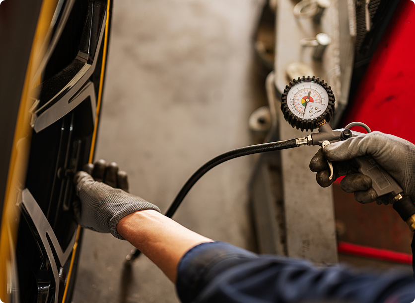 mechanic with black rubber gloves preparing to rem