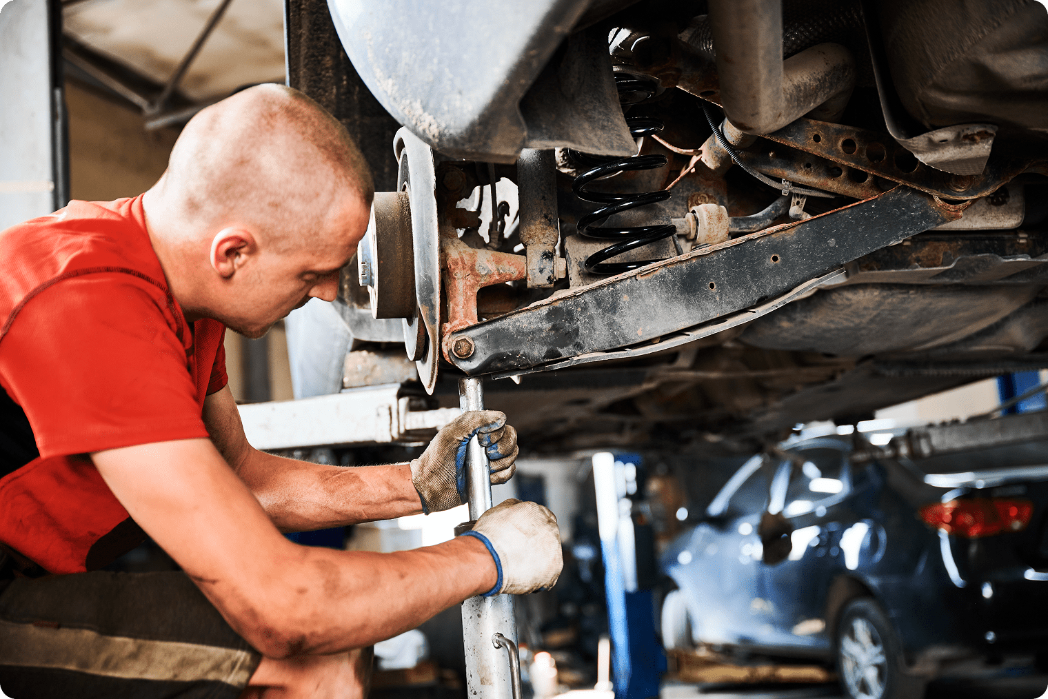 Professional worker repairman changing car wheel