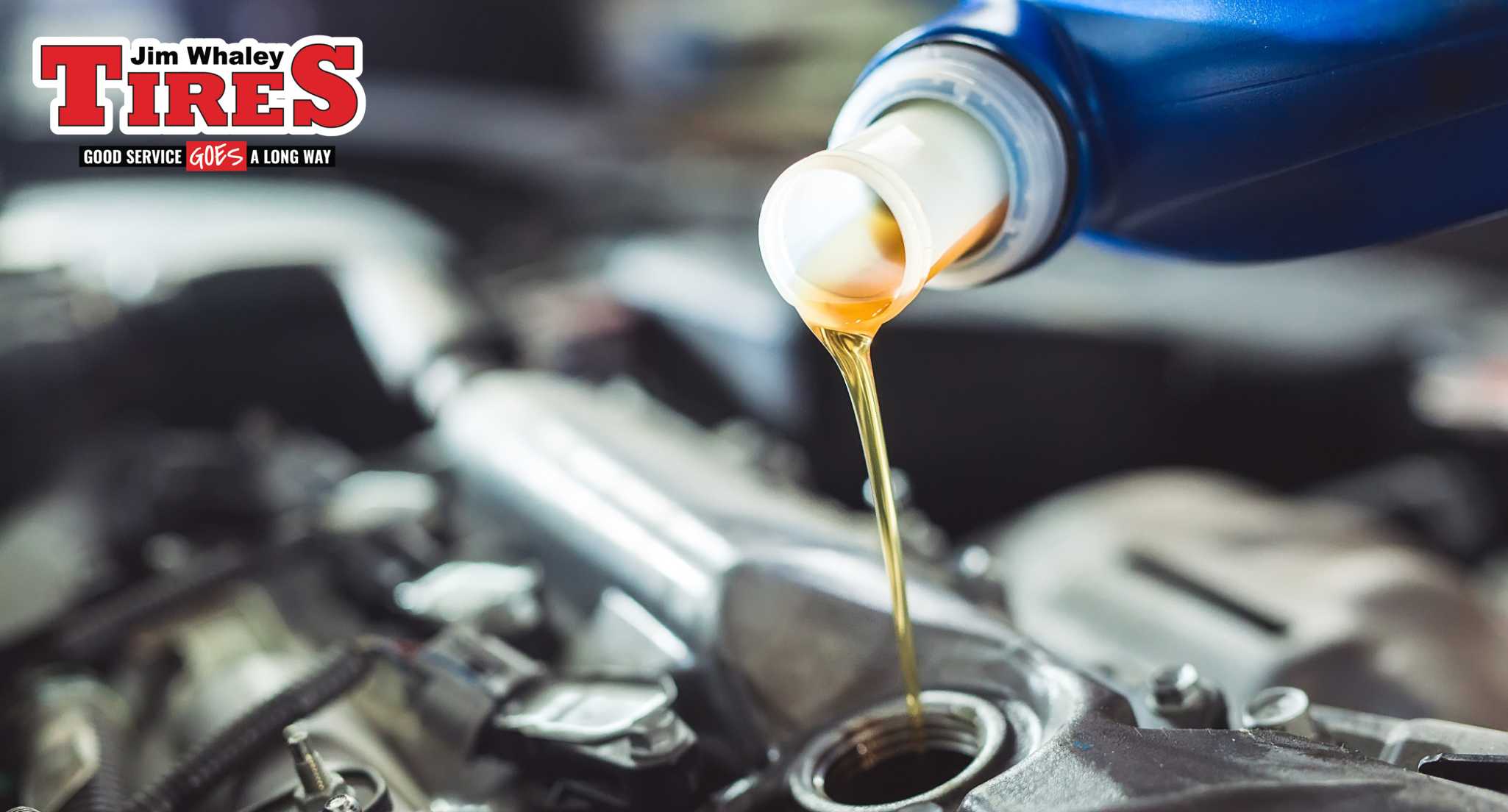 Jim Whaley Tires technician performing an oil change on a car in Enterprise AL