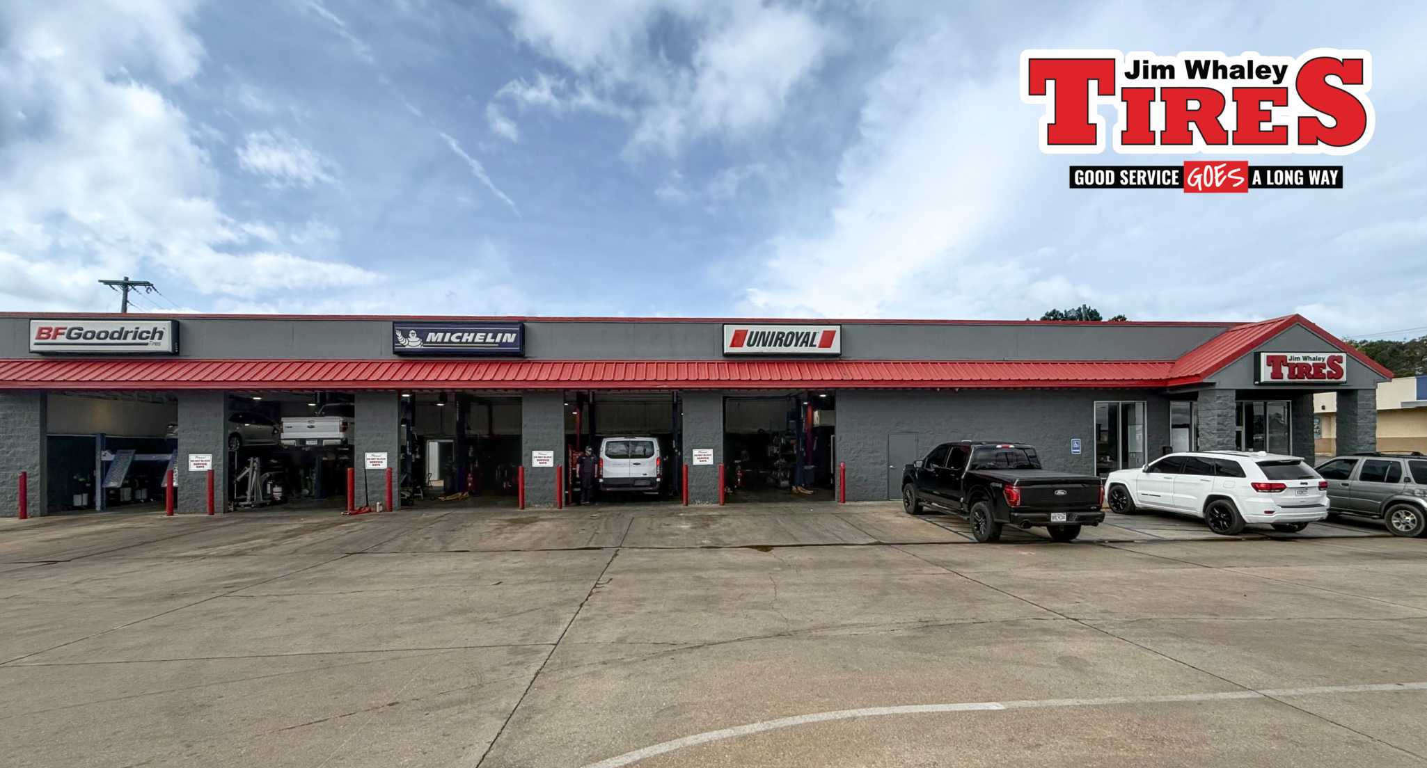 Mechanic inspecting tire wear on vehicle in Troy Alabama Wheel alignment service at auto repair shop in Alabama