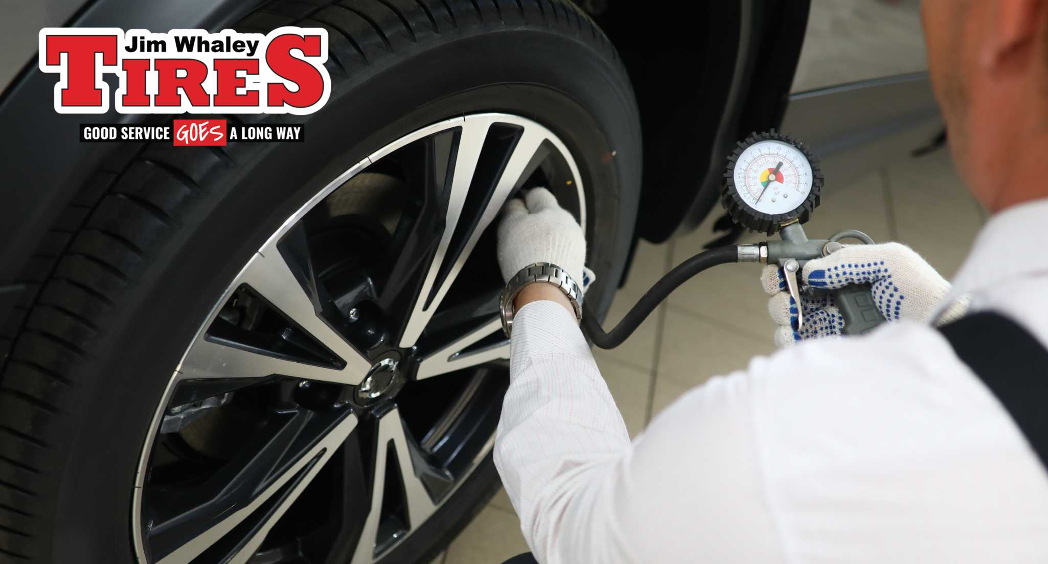 Technician performing tire care for Dothan AL West Main St drivers at Jim Whaley