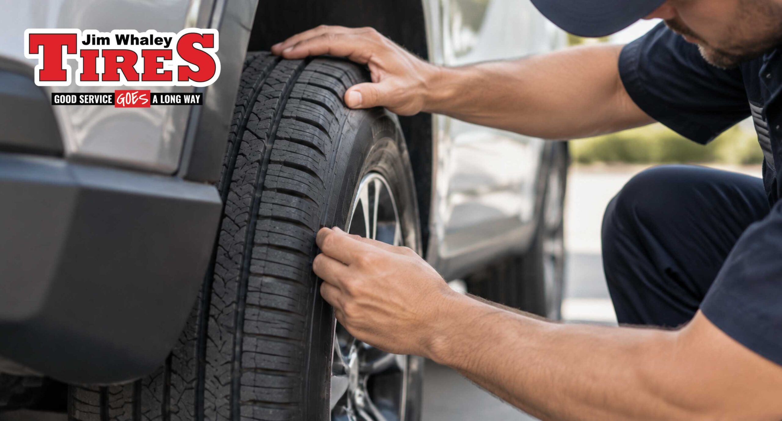 Technician inspecting tires before highway travel in Ozark Alabama